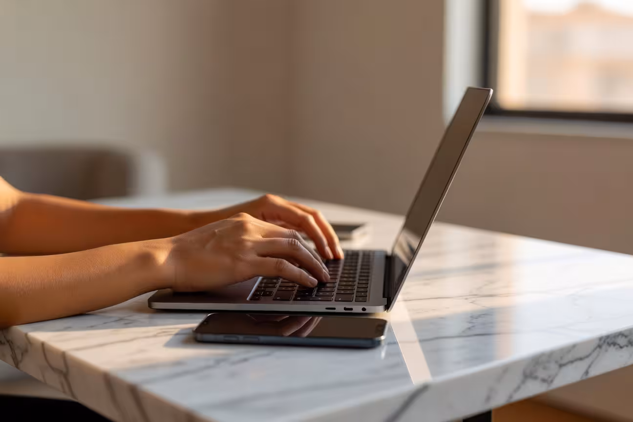 Person creating online dating profile on laptop
